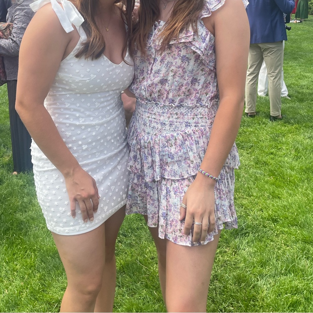 LoveShackFancy dress it’s white with floral designs